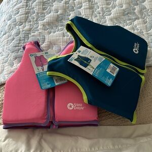 Sand Dollar Swim Trainer vest. 1-Blue & 1-Pink up to 50lbs 4-6 years old NWT